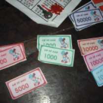 Cash. Note that the 10,000 dong bills come in various colours. Also note the use of a familiar mouse character.